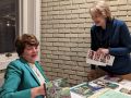 susan v. with her books and info 