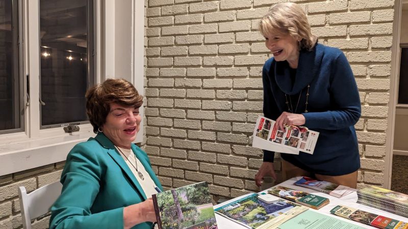susan v. with her books and info 